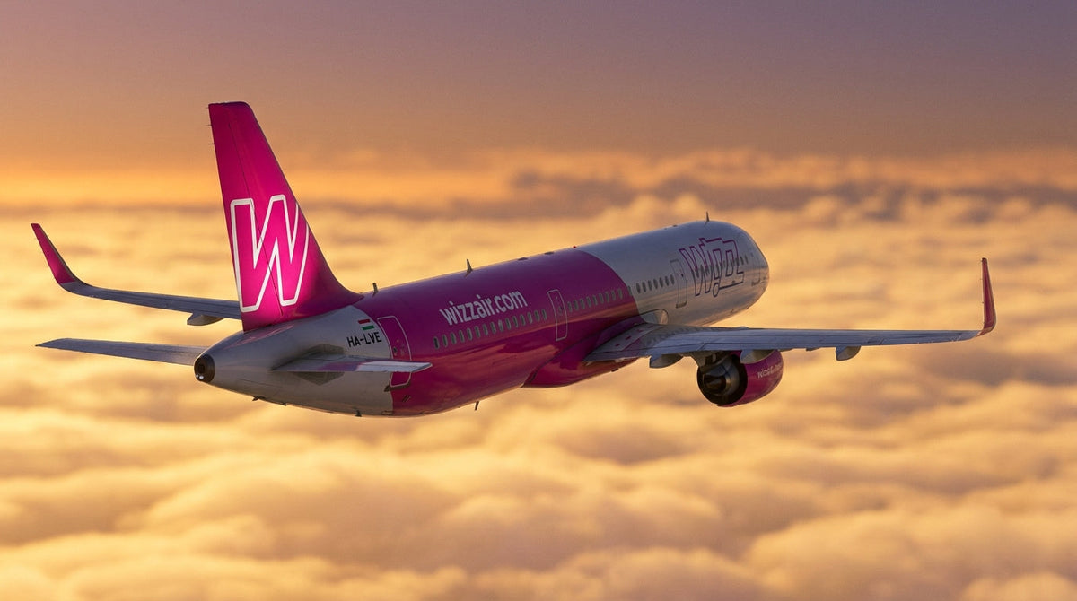 Wizz Air Airbus A321neo in flight at dawn