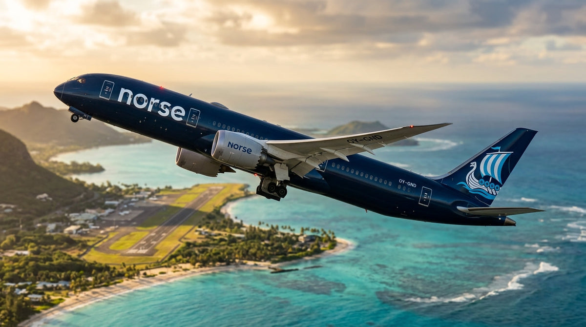 Boeing 787-9 in Norse Atlantic Airways livery climbing over a tropical coastline