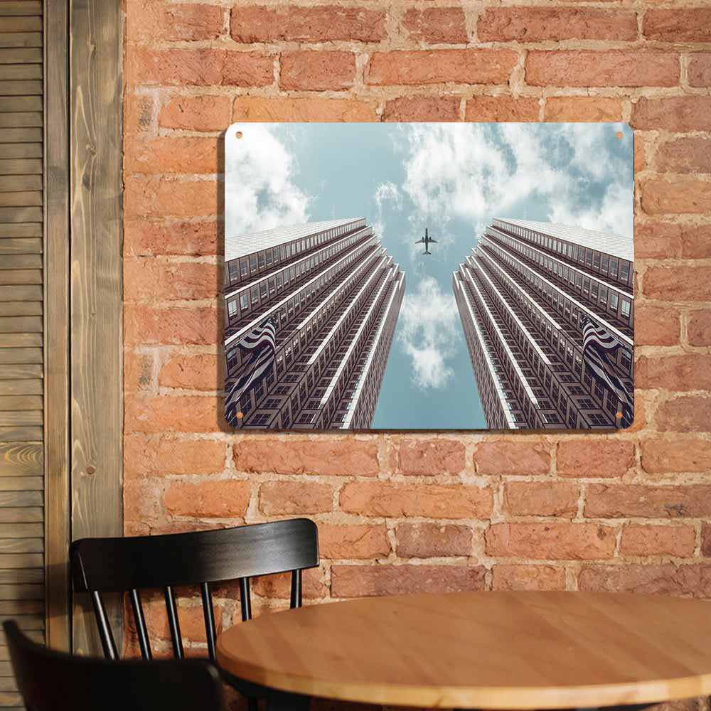 Airplane Flying over Big Buildings Printed Metal Sign