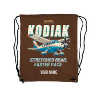 Thumbnail for Daher Kodiak 900 - Drawstring Bag - Cartoon + Name - Brown