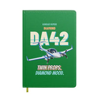 Thumbnail for Diamond DA42 - Twin props. Diamond mood. design on green notebook