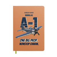Thumbnail for Douglas A-1H Skyraider - One big prop. Nonstop charm. design on orange notebook