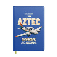 Thumbnail for Piper PA-23-250 Aztec - Twin props. Big weekends. design on blue notebook