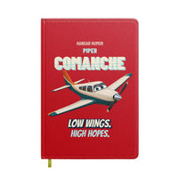 Thumbnail for Piper PA-24-250 Comanche - Low wings. High hopes. design on red notebook