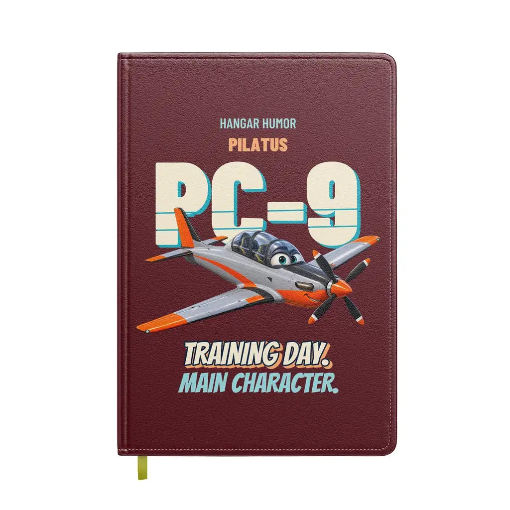 Pilatus PC-9M - Training day. Main character. design on dark red notebook