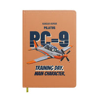 Thumbnail for Pilatus PC-9M - Training day. Main character. design on orange notebook