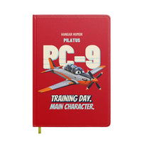 Thumbnail for Pilatus PC-9M - Training day. Main character. design on red notebook