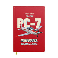 Thumbnail for Pilatus PC-7 - Three blades. Endless grins. design on red notebook