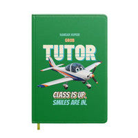 Thumbnail for Grob G 115E Tutor - Class is up. Smiles are in. design on green notebook