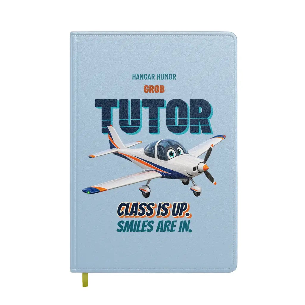 Grob G 115E Tutor - Class is up. Smiles are in. design on light blue notebook