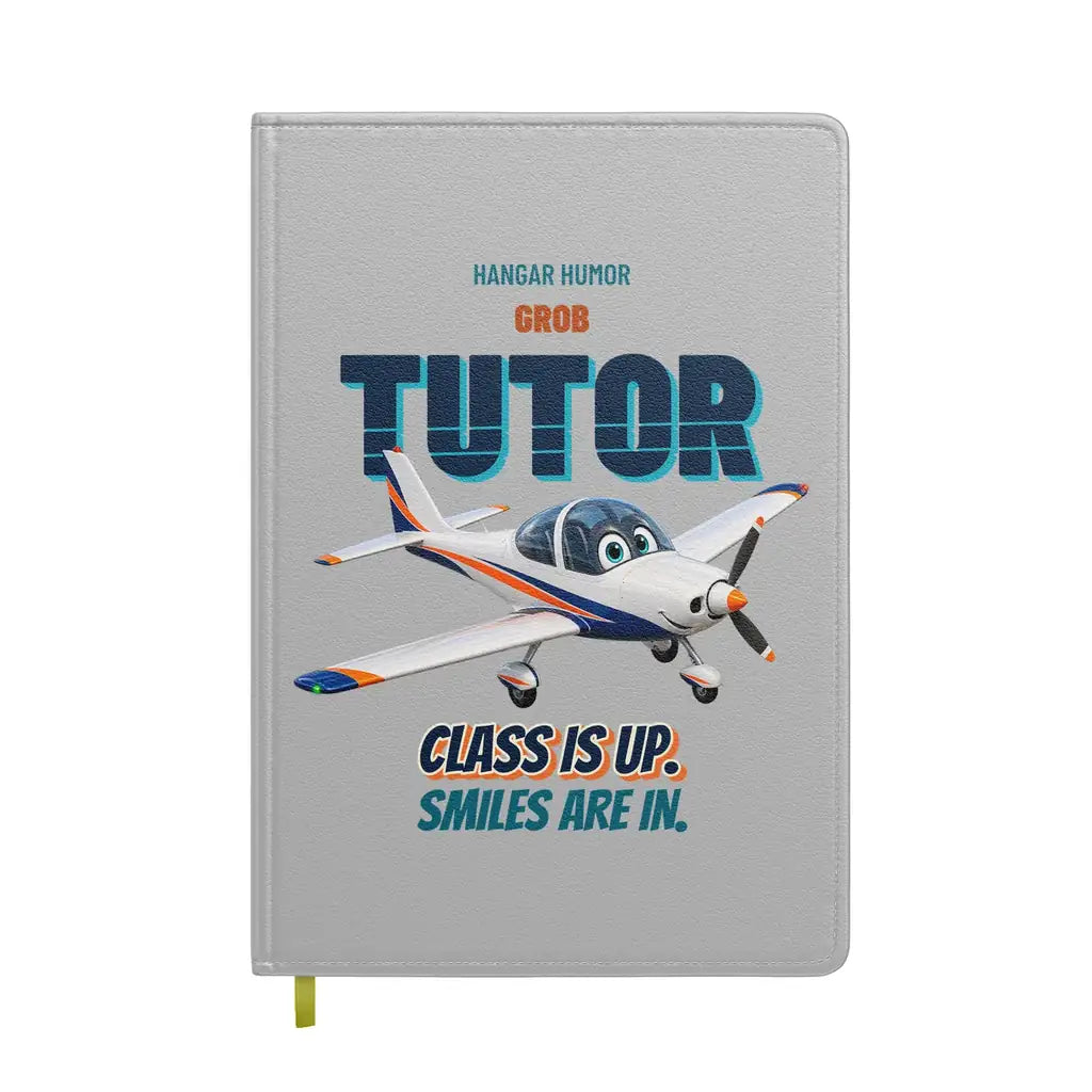 Grob G 115E Tutor - Class is up. Smiles are in. design on light gray notebook