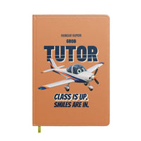 Thumbnail for Grob G 115E Tutor - Class is up. Smiles are in. design on orange notebook