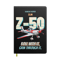 Thumbnail for Zlin Z-50LS - Roll with it. Grin through it. design on black notebook