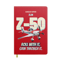 Thumbnail for Zlin Z-50LS - Roll with it. Grin through it. design on red notebook
