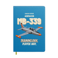 Thumbnail for Aermacchi MB-339A - Training day. Playful way. design on turquoise notebook