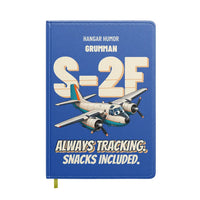 Thumbnail for Grumman S-2F Tracker - Always tracking. Snacks included. design on blue notebook