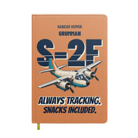 Thumbnail for Grumman S-2F Tracker - Always tracking. Snacks included. design on orange notebook