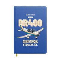 Thumbnail for Robin DR400 - Bent wings. Straight joy. design on blue notebook