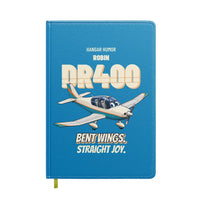 Thumbnail for Robin DR400 - Bent wings. Straight joy. design on turquoise notebook