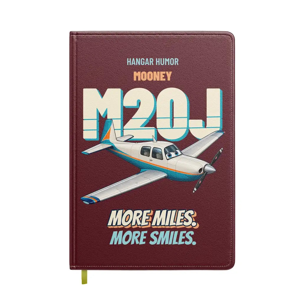 Mooney M20J - More miles. More smiles. design on dark red notebook