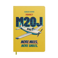 Thumbnail for Mooney M20J - More miles. More smiles. design on yellow notebook