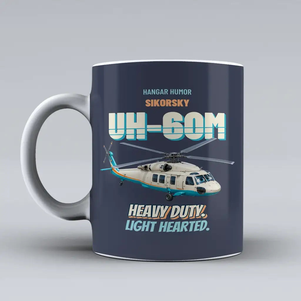 Sikorsky UH-60M Black Hawk - Heavy duty. Light hearted. design on dark blue ceramic mug