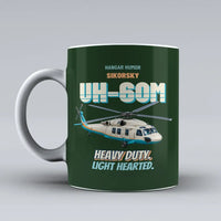 Thumbnail for Sikorsky UH-60M Black Hawk - Heavy duty. Light hearted. design on dark green ceramic mug