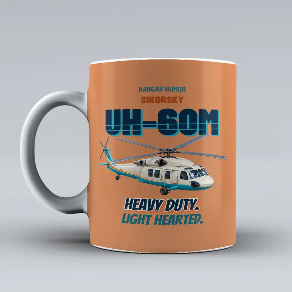 Sikorsky UH-60M Black Hawk - Heavy duty. Light hearted. design on orange ceramic mug