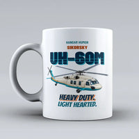 Thumbnail for Sikorsky UH-60M Black Hawk - Heavy duty. Light hearted. design on white ceramic mug