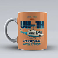 Thumbnail for Bell UH-1H Iroquois Huey - Classic beat. Fresh attitude. design on orange ceramic mug
