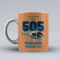 Thumbnail for Bell 505 - Fresh look. Familiar sky. design on orange ceramic mug