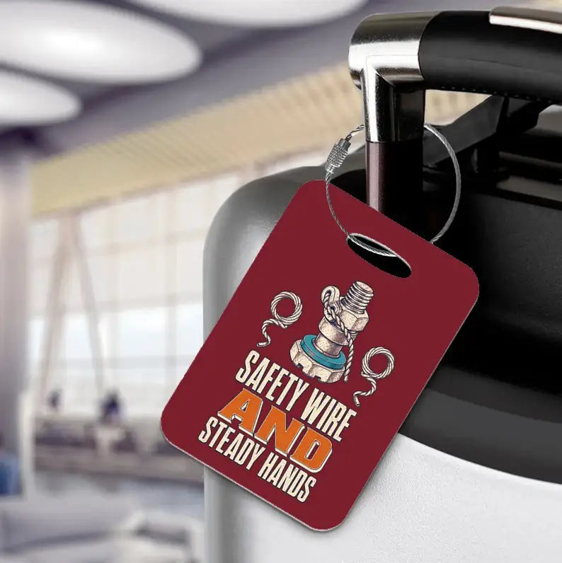 SIGNAL 239 - Safety Wire And Steady Hands - Luggage Tag design on dark red luggage tag