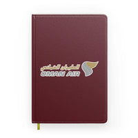 Thumbnail for Oman Airlines design on dark red notebook
