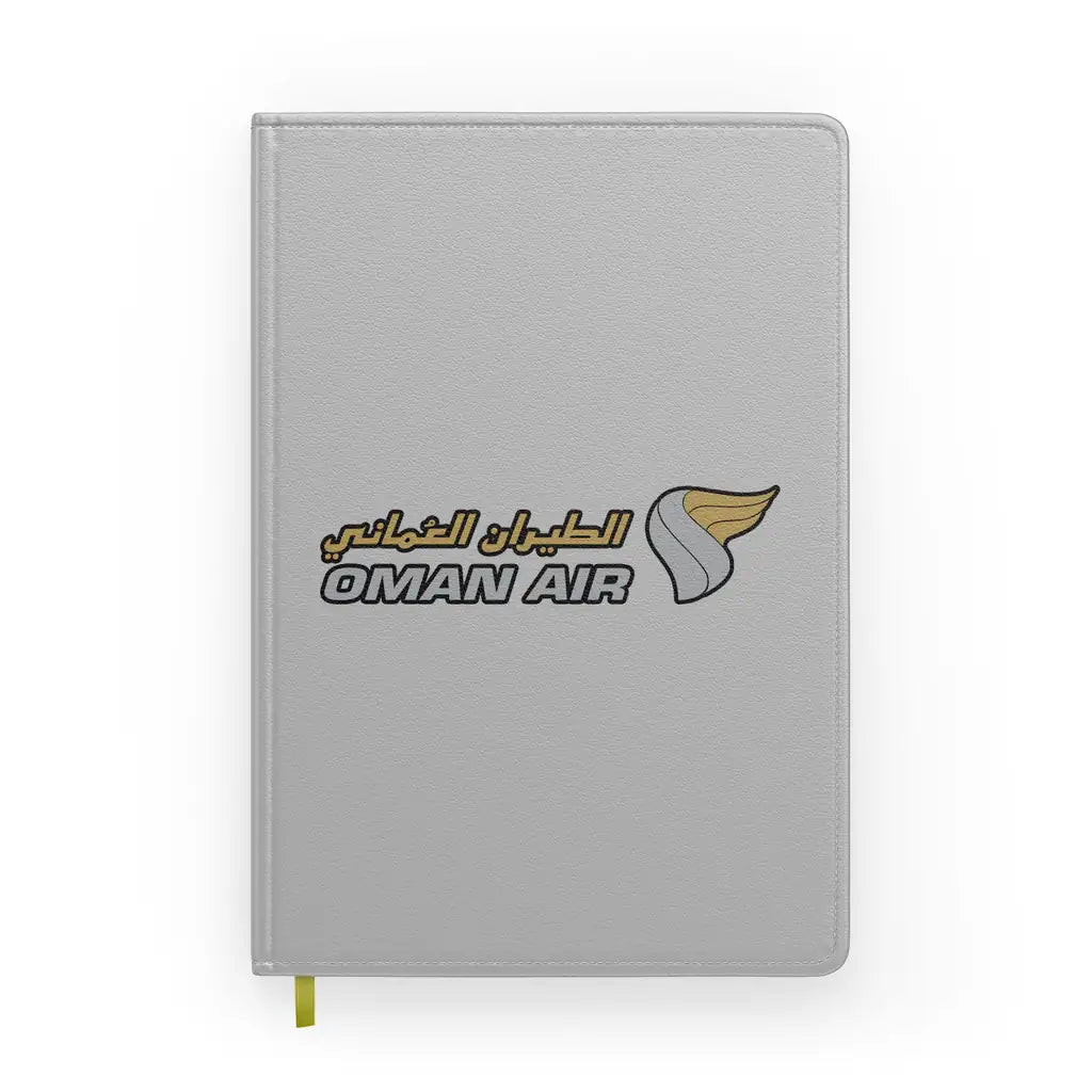 Oman Airlines design on light gray notebook
