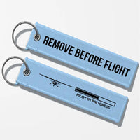Thumbnail for Pilot In Progress (Cessna) Key Chains - Light Blue - Remove Before Flight