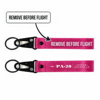 Thumbnail for Piper PA-28-181 Archer LX Hawk-Shaped Key Chains - Pink - Heritage - Remove Before Flight