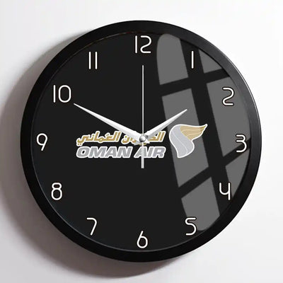 Oman Airlines design on black framed wall clock