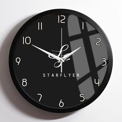 StarFlyer Airlines design on black framed wall clock