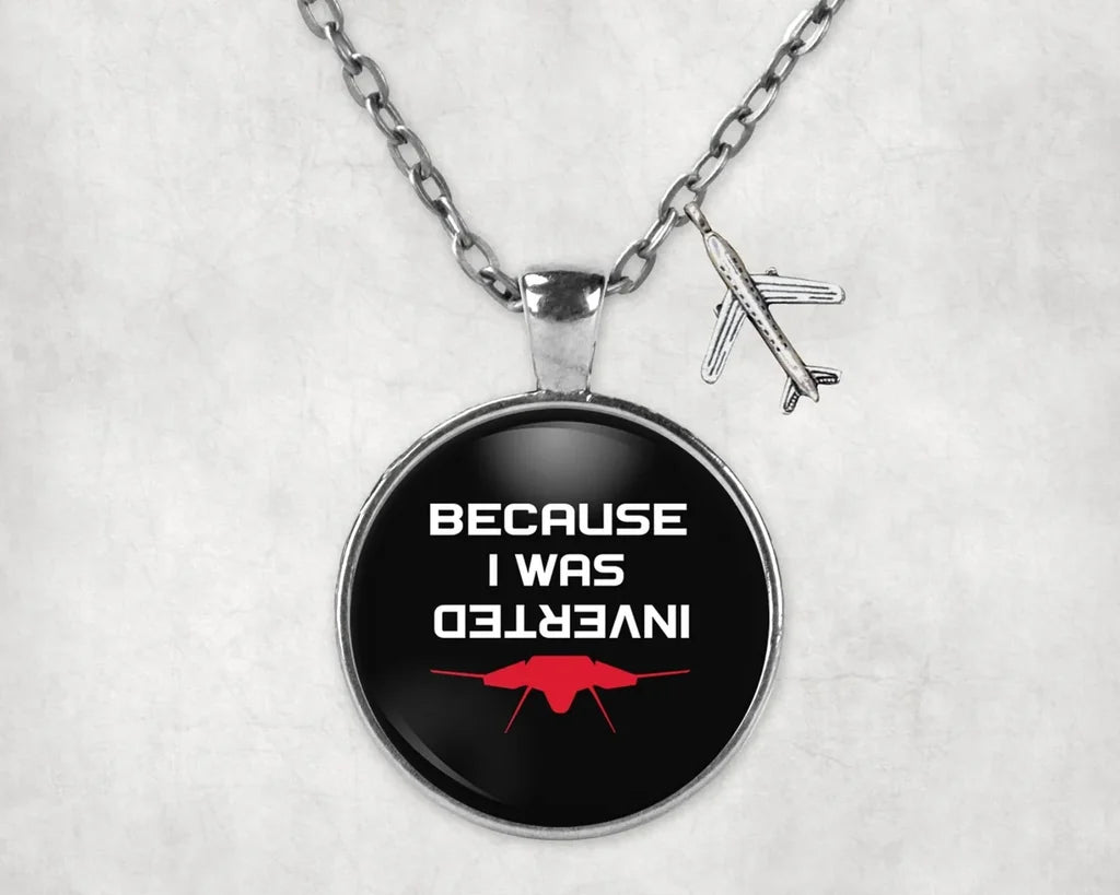 Because I was Inverted aviation-themed necklace, polished stainless steel.