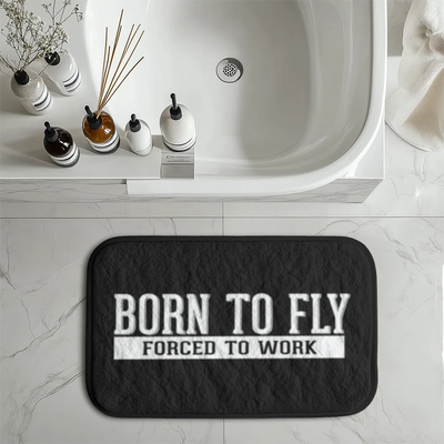 Born To Fly Forced To Work aviation design on soft absorbent fabric with non-slip backing bath mat.