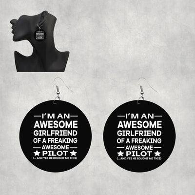 Side view of I am an Awesome Girlfriend aviation drop earrings in wood with metal hooks, polished finish.