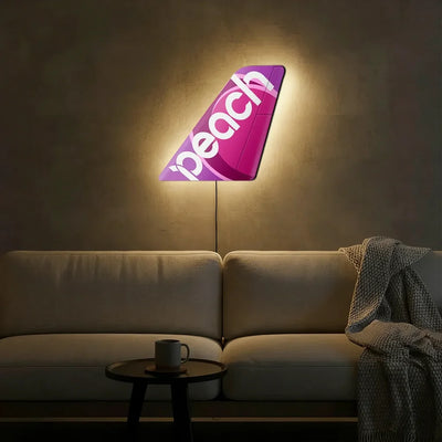 Peach Airlines aviation design on durable metal with LED aircraft tail wall art.
