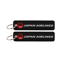 Thumbnail for JAL (Japan Airlines Black) aviation Remove Before Flight key chain, aviation-tag style webbing.