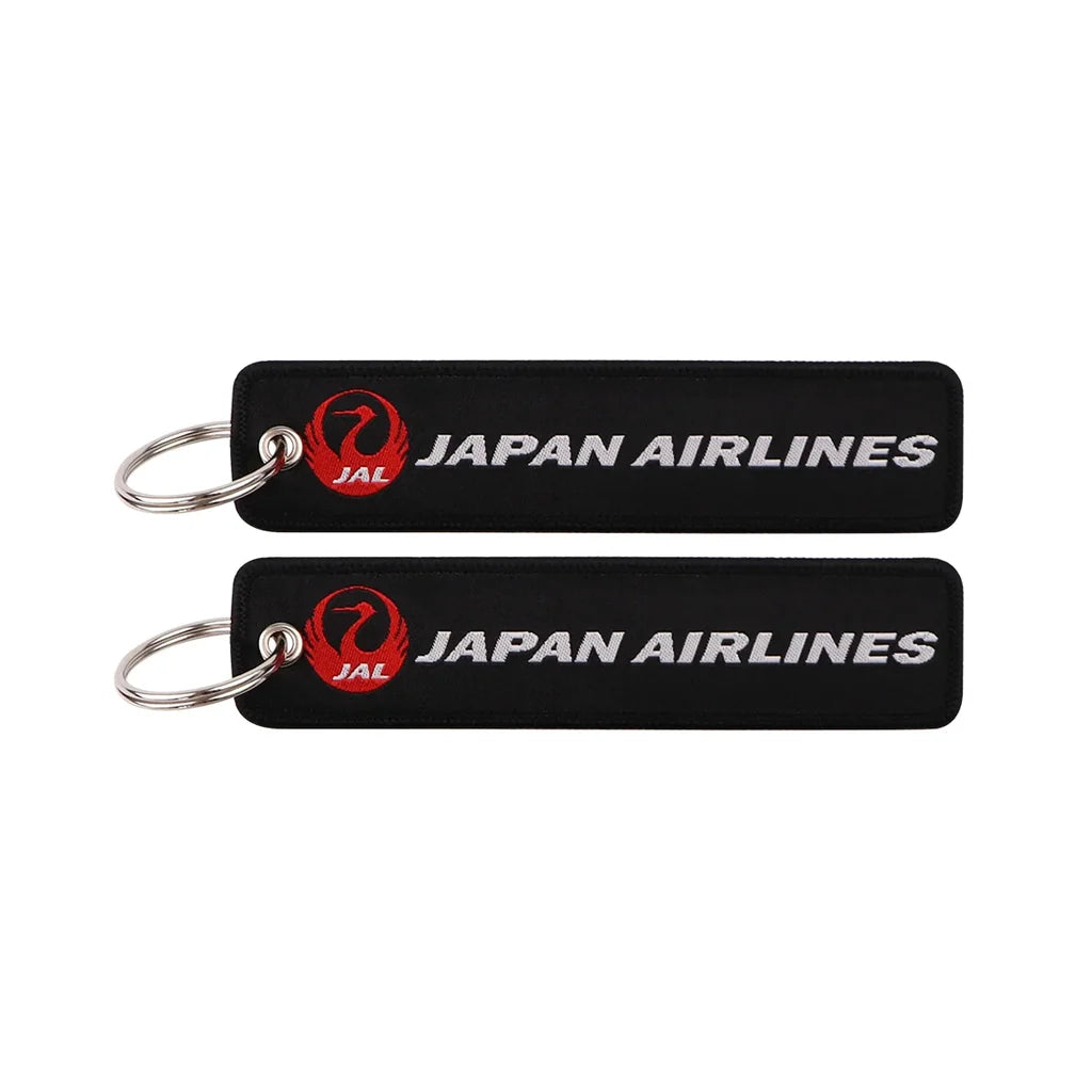 JAL (Japan Airlines Black) aviation Remove Before Flight key chain, aviation-tag style webbing.