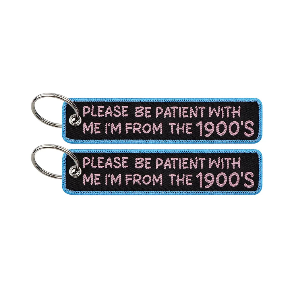 PLEASE BE PATIENT WITH ME I'M FROM THE 1900'S aviation fashion key chain in polished metal.