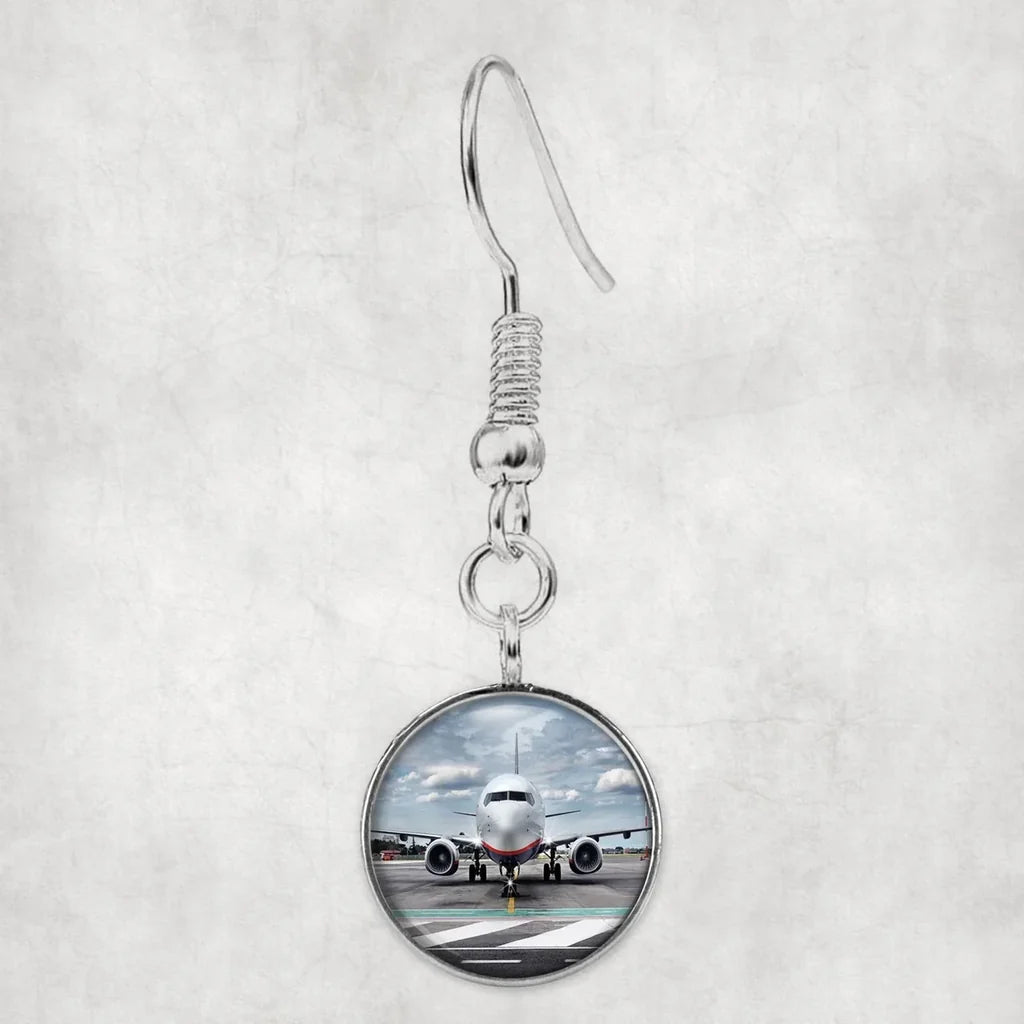 Side view of Amazing Clouds and Boeing 737 NG aviation earrings in hypoallergenic alloy, polished finish.