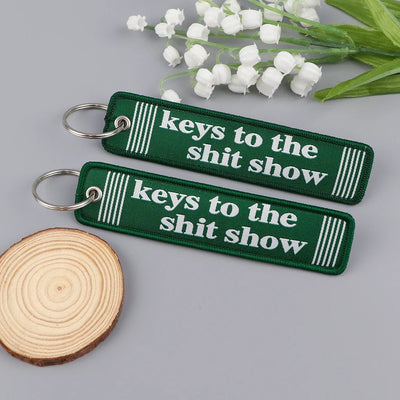 Keys to the Shitshow aviation fashion key chain in polished metal.
