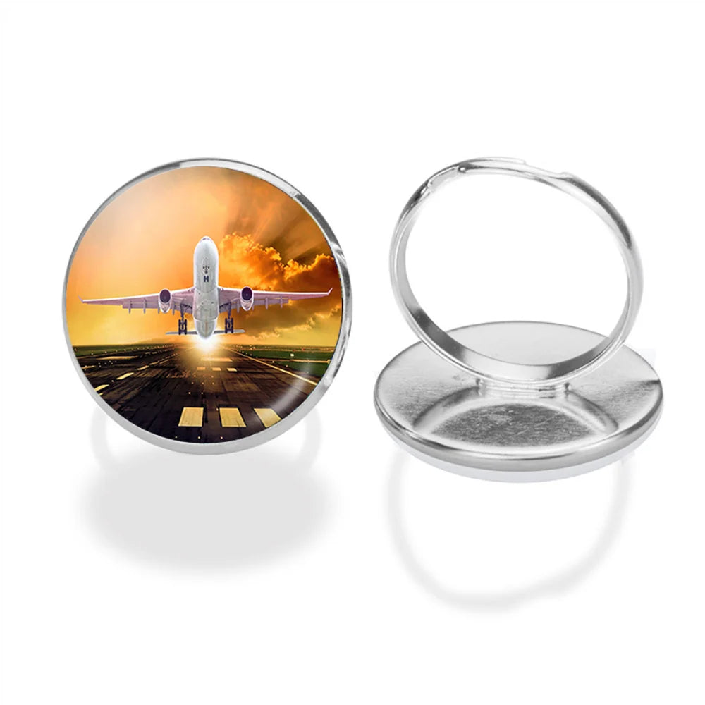 Amazing Departing Aircraft Sunset & Clouds Behind aviation ring in stainless steel.