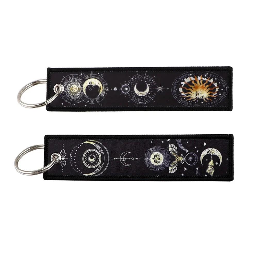 Cosmic Astrology Secrets aviation fashion key chain in polished metal.
