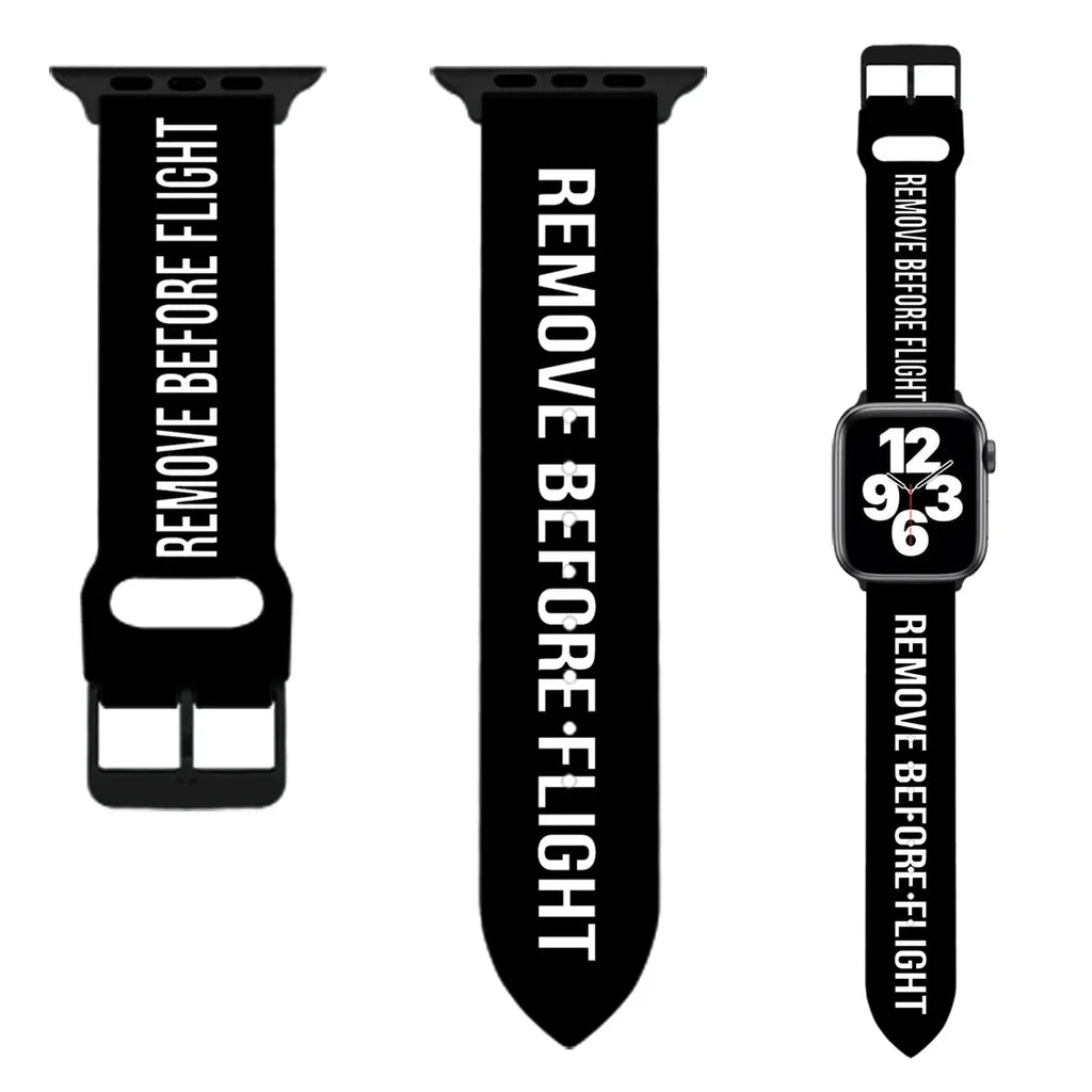 Side view of Remove Before Flight aviation Apple Watch band in soft silicone, polished finish.